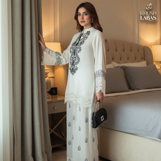 Khushbu-e-Bahar : An elegant two-piece suit featuring delicate floral embroidery