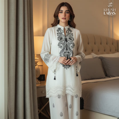 Khushbu-e-Bahar : An elegant two-piece suit featuring delicate floral embroidery