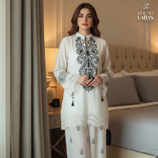Khushbu-e-Bahar : An elegant two-piece suit featuring delicate floral embroidery